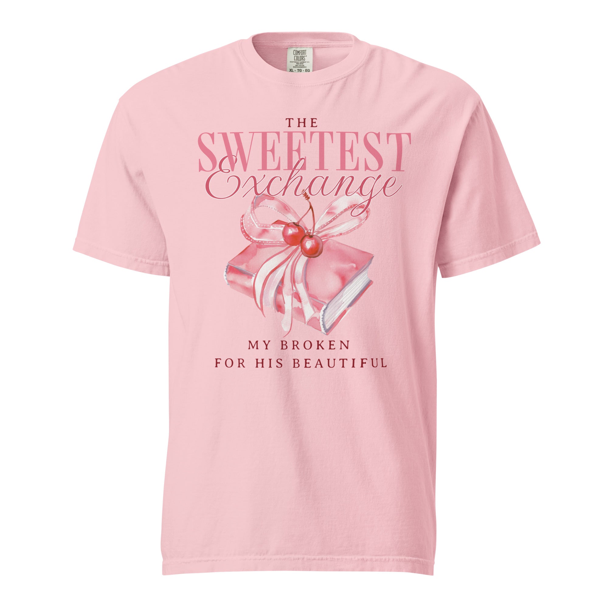 Pink t-shirt with graphic design and text on a white background